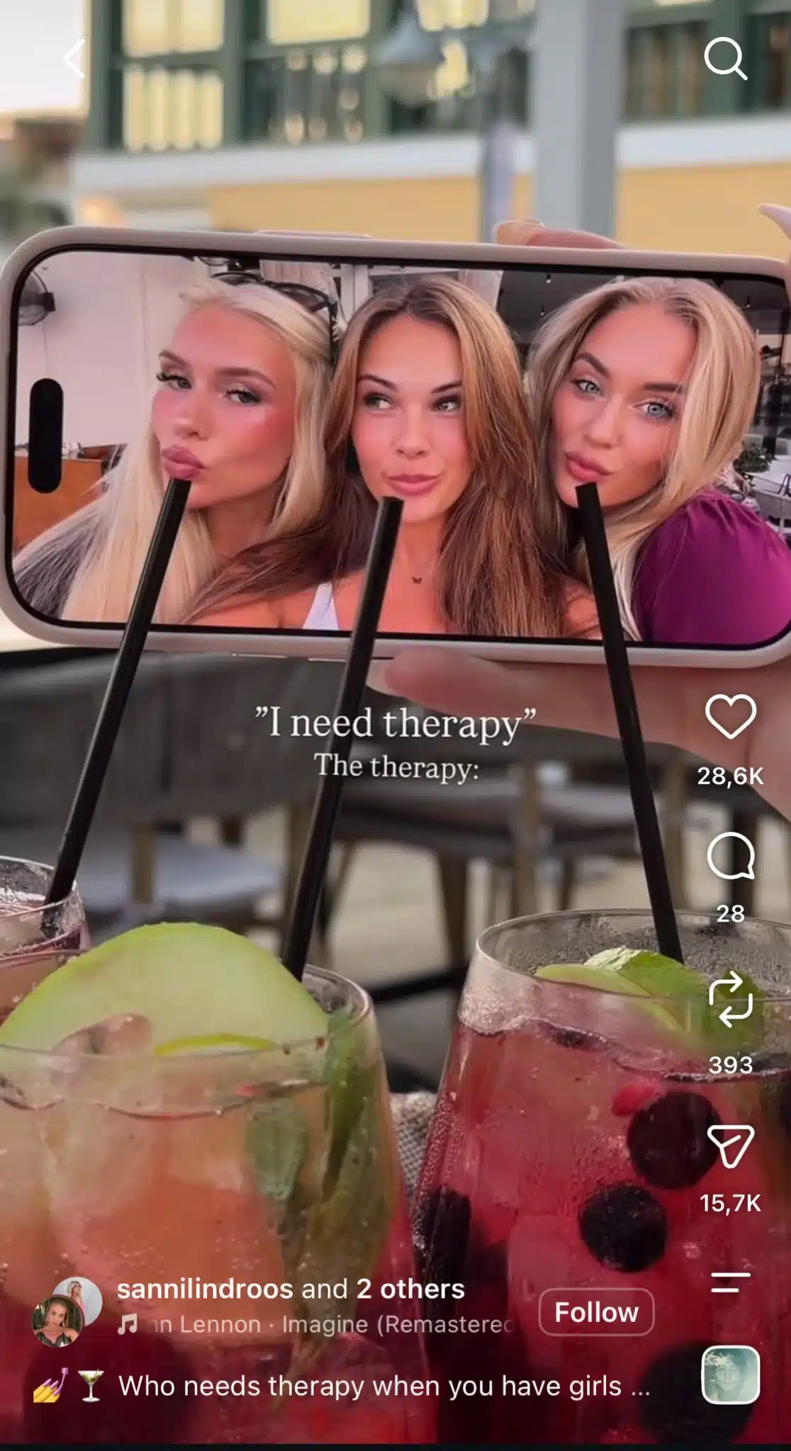 Instagram Reel showing cocktails and a phone photo of three friends, with text reading “I need therapy. The therapy,” joking about spending time with friends as a form of therapy.