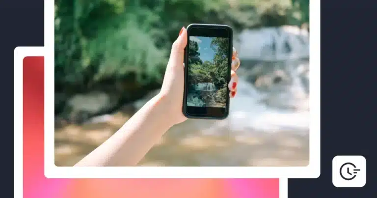 Person holding a smartphone displaying a photo of a waterfall outdoors, representing an Instagram trial Reel.