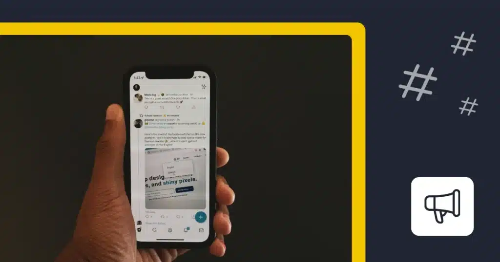 Person holding a phone open to an Twitter feed beside hashtag symbols and a megaphone icon.
