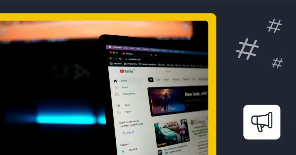 YouTube open on a computer screen beside hashtag symbols and a megaphone icon.