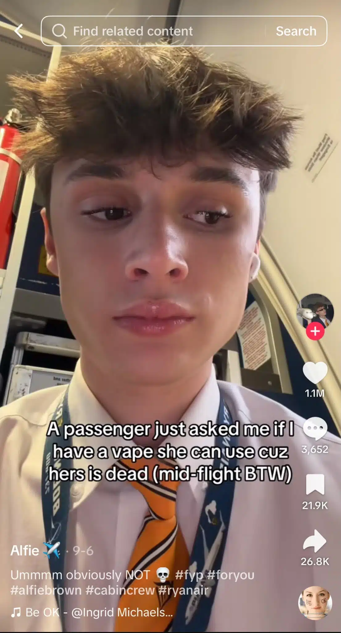 TikTok video from Alfie showing a flight attendant in a white shirt and yellow tie inside an aircraft cabin. Text reads, “A passenger just asked me if I have a vape she can use cuz hers is dead (mid-flight BTW).”