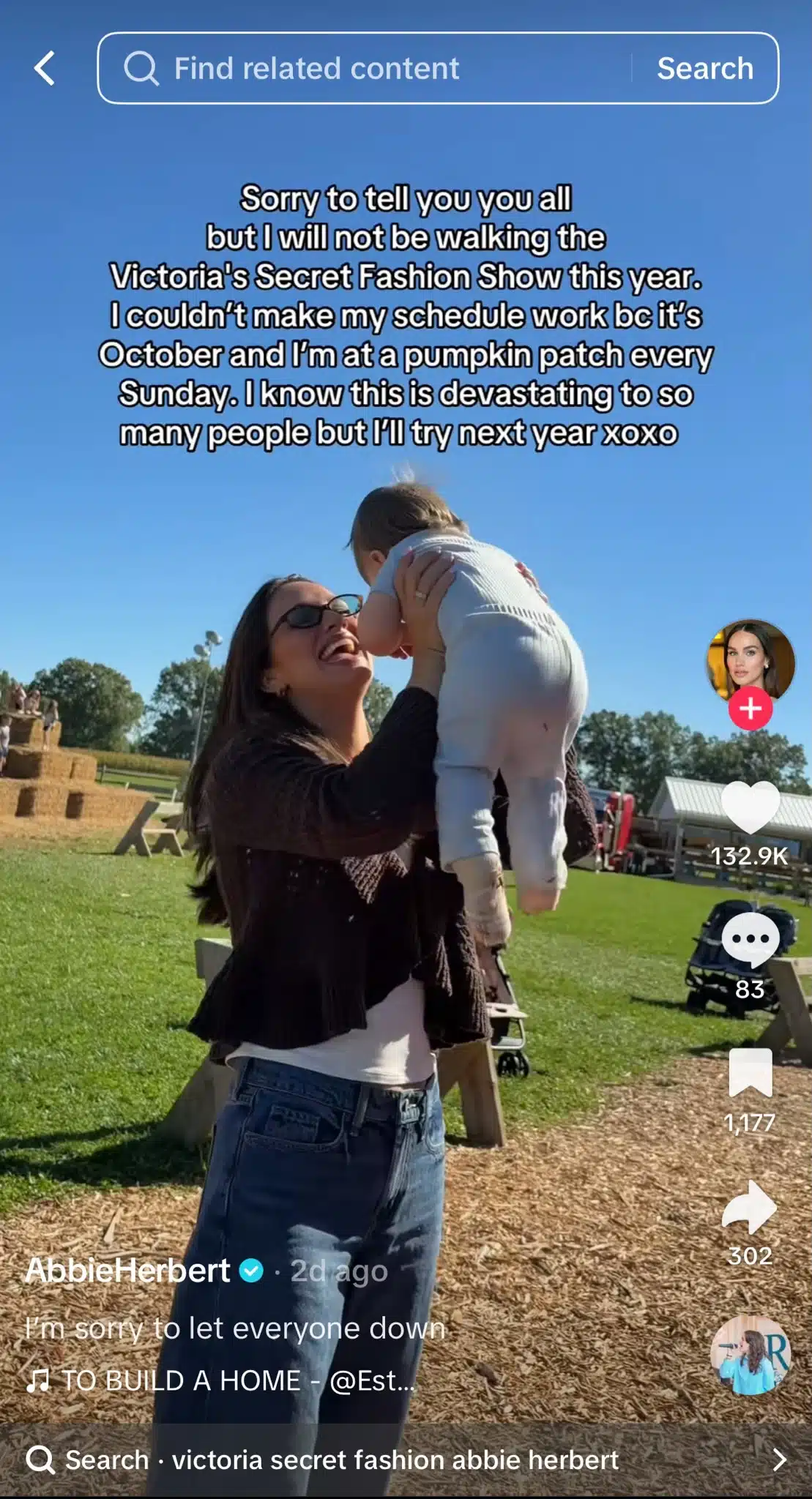 TikTok video from @AbbieHerbert showing a woman lifting a baby at a pumpkin patch. Text on screen jokes about missing the Victoria's Secret Fashion Show because she spends every Sunday in October at a pumpkin patch.
